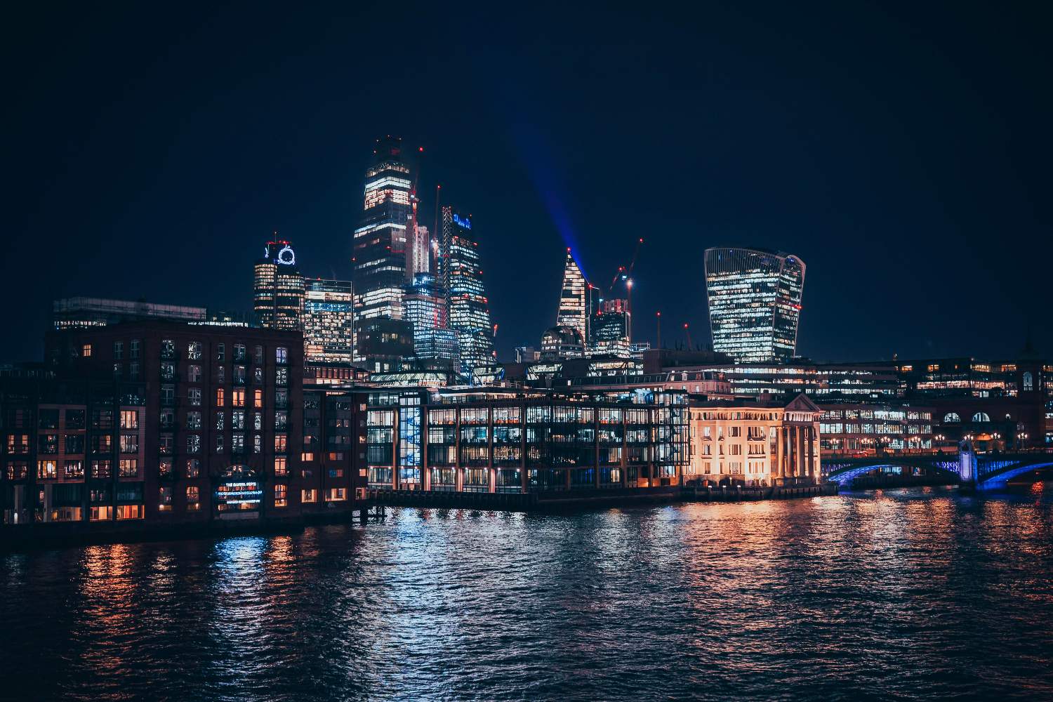 The London skyline at night with illuminated commercial towers - template-1
