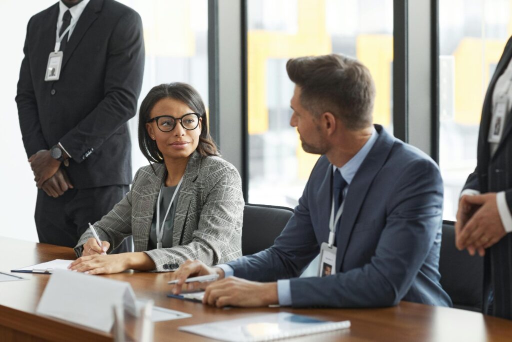 A woman and a man in a business finance meeting - unsecured business loans and merchant cash advances